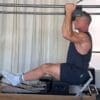 Sean Bergara doing pull-ups on Pilates Cadillac